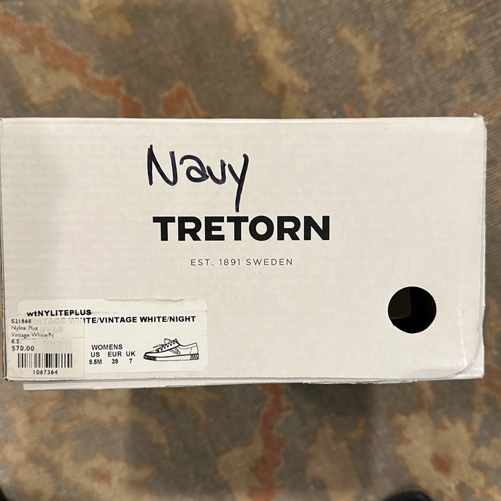 Tretorn white with navy accents. Size 8.5